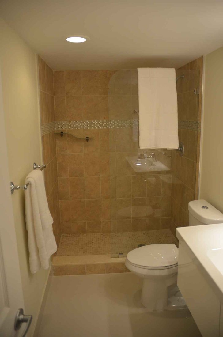Bathroom remodeling Hollywood FL – walk-in tile shower with stone accents