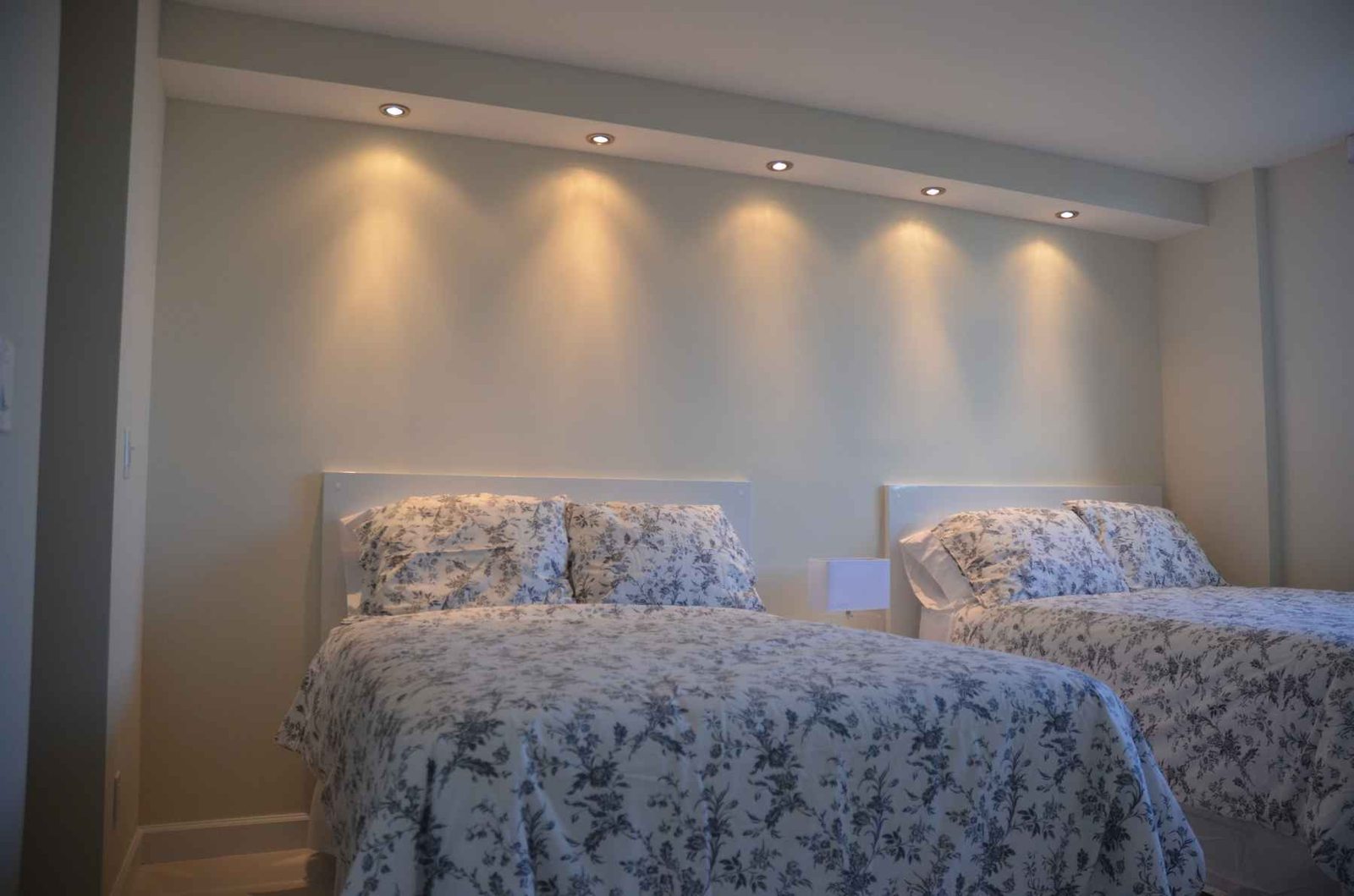 Bedroom remodel Miami – recessed lighting and custom headboard wall