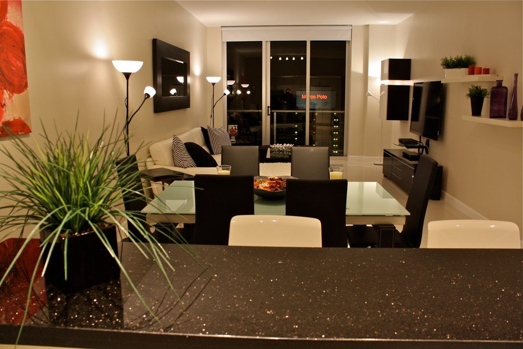 Modern kitchen renovation South Florida – peninsula layout with stainless appliances